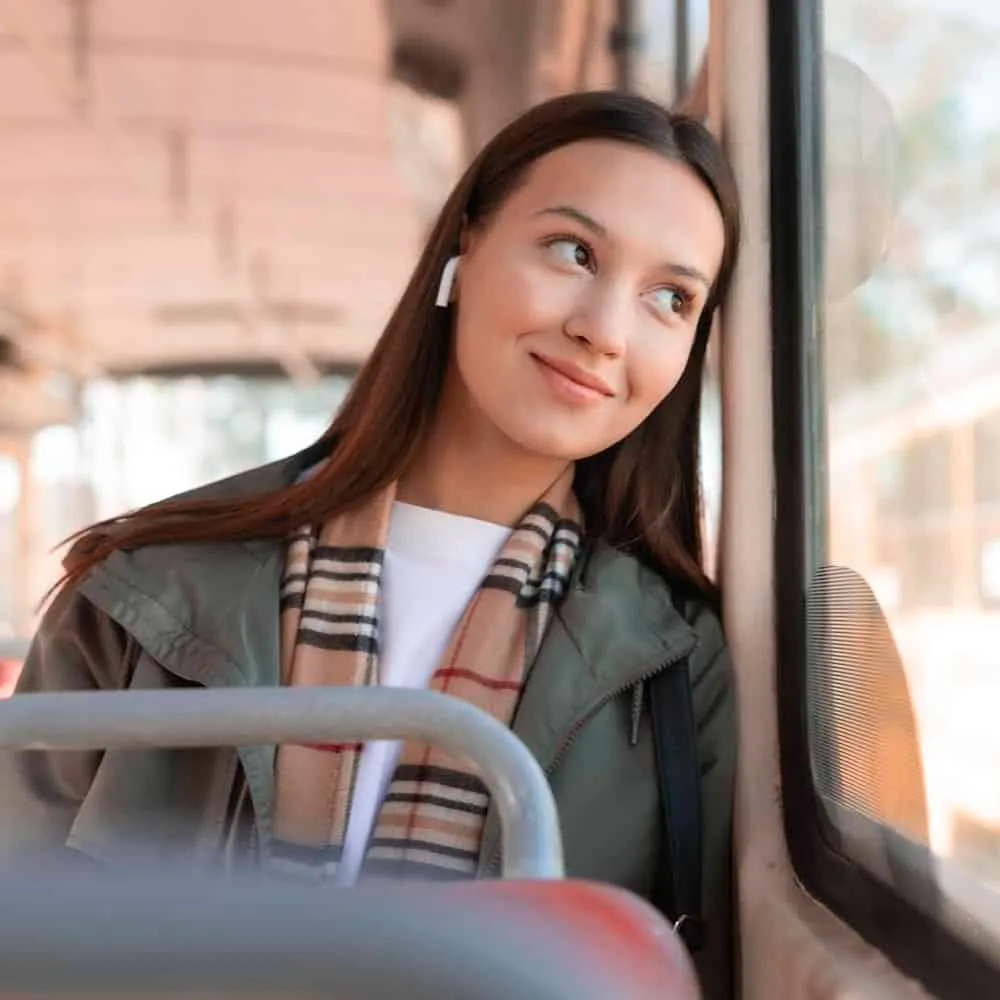 Woman smiling while looking off to the side